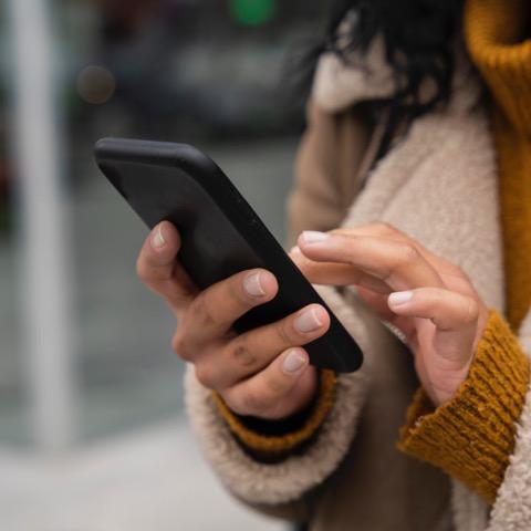 Image of a woman with a smartphone